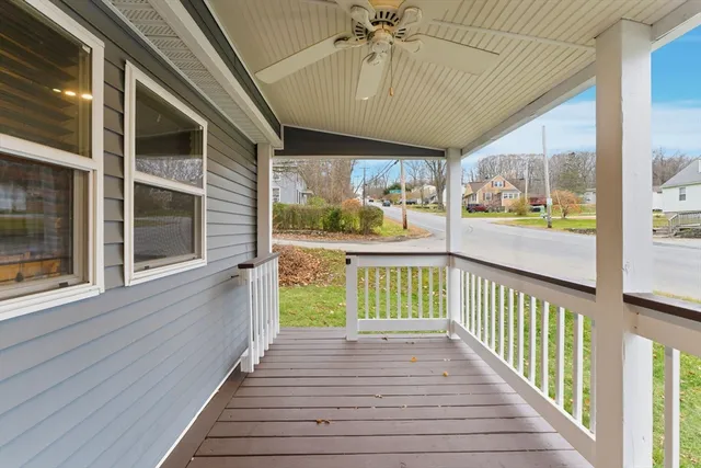 a view of a porch with wooden floor and outdoor space