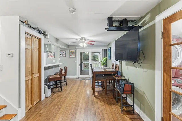 a view of a livingroom with furniture wooden floor and a rug