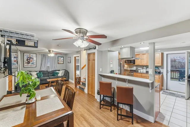 a view of a dining room with furniture window and wooden floor