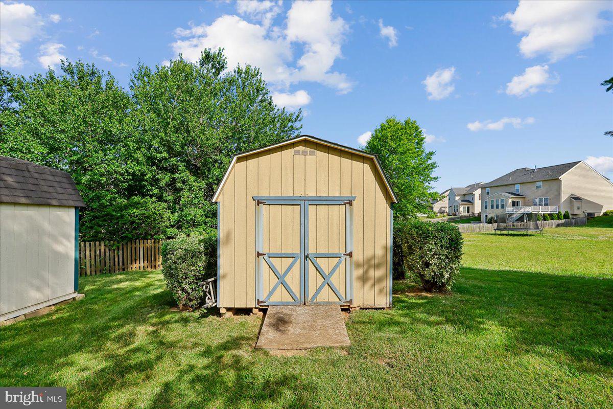 107 Redcloud Court Frederick, MD 21702 - Photo 68 of 78 Charming shed in a lush backyard.