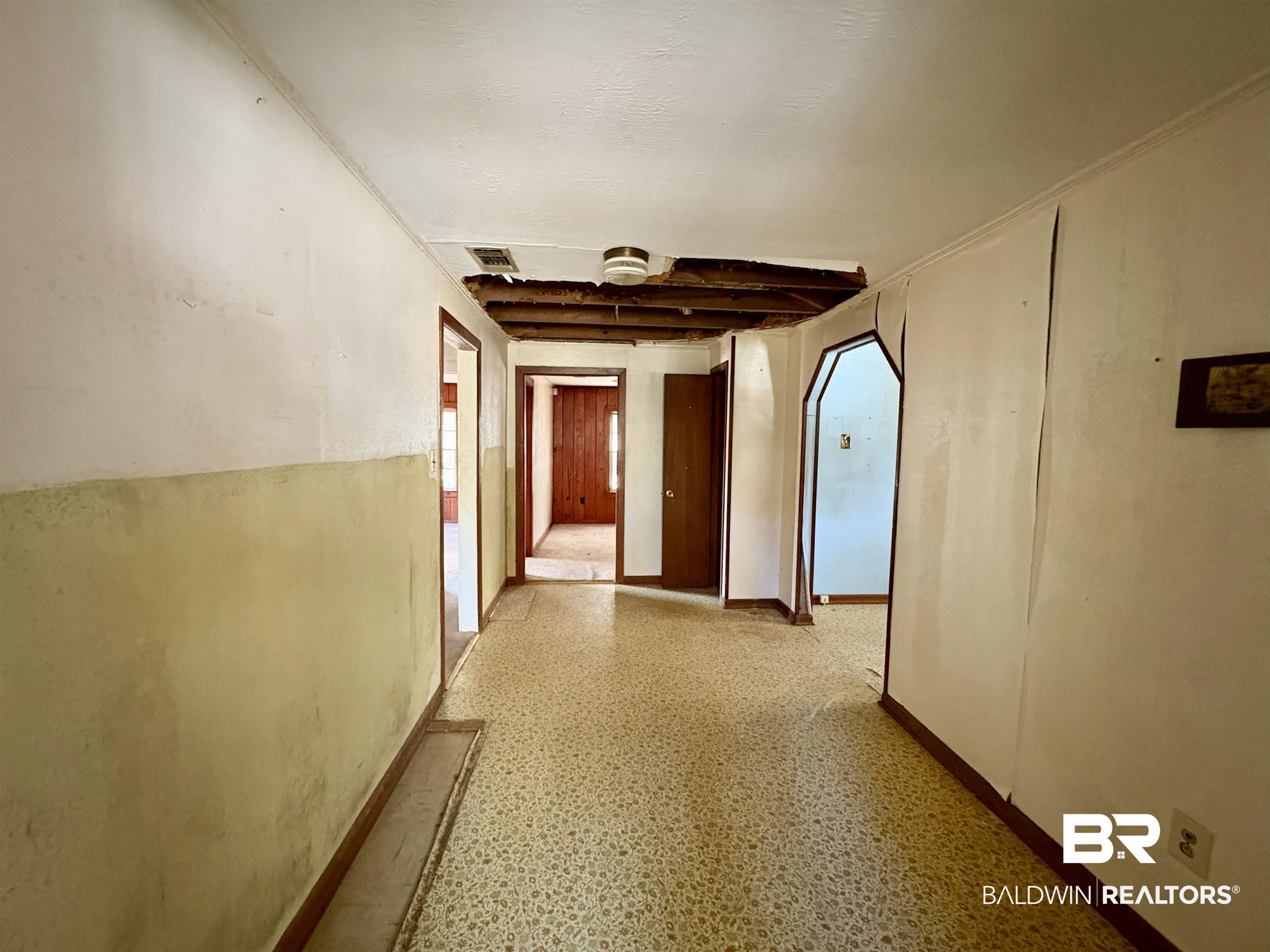 4060 Dickson Lane Mobile, AL 36618 - Photo 8 of 16 Corridor featuring light flooring and arched walkways