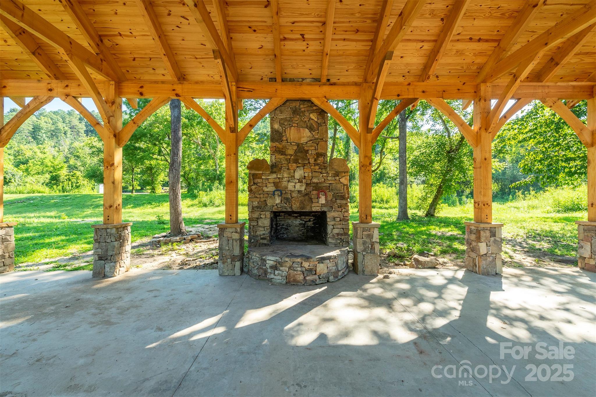 230 White Rapid Road Marshall, NC 28753 - Photo 25 of 29 a view of a yard with large trees and a tub