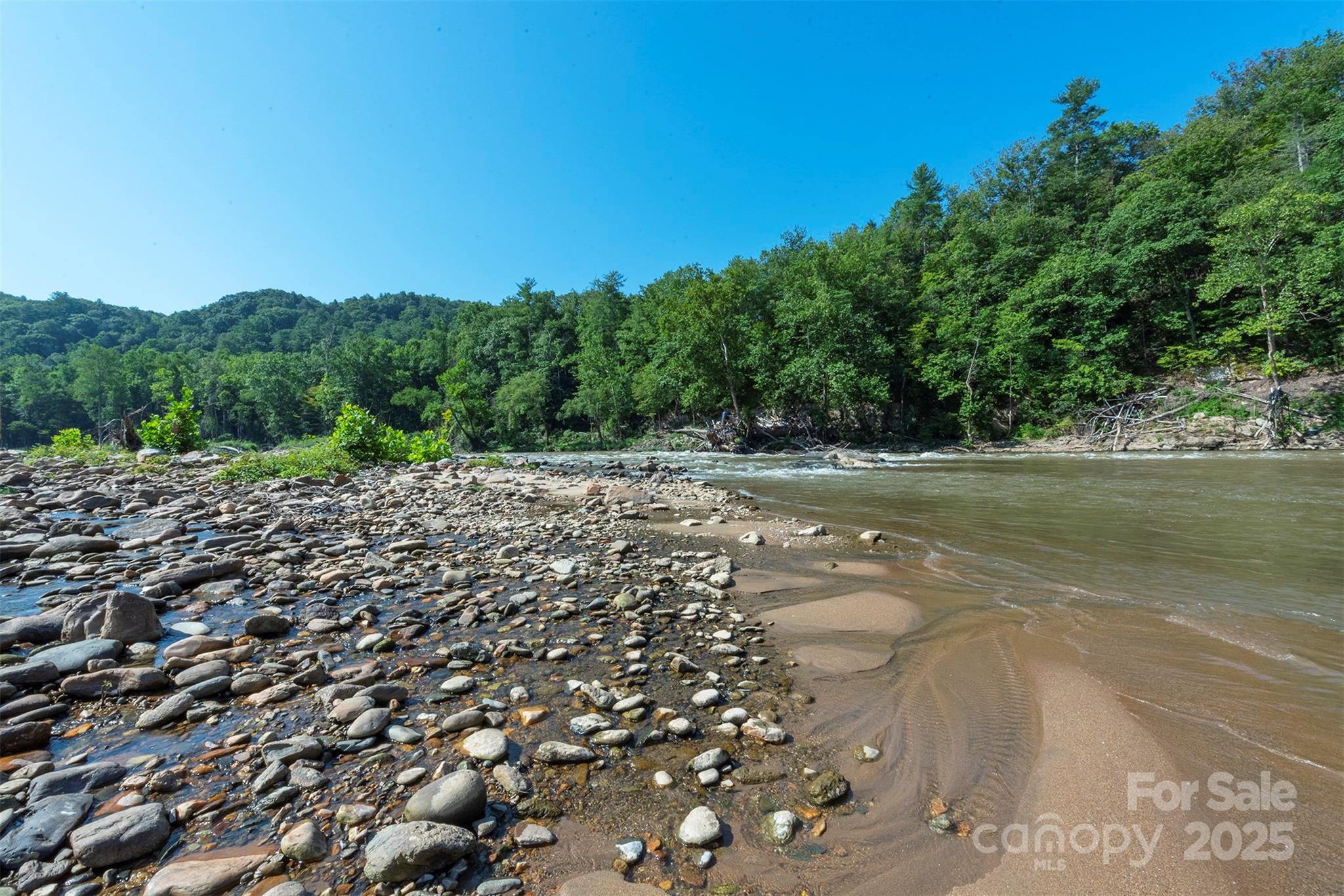 230 White Rapid Road Marshall, NC 28753 - Photo 28 of 29 a view of a lake with a mountain