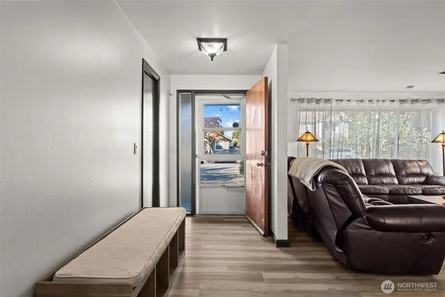 a view of room with wooden floor