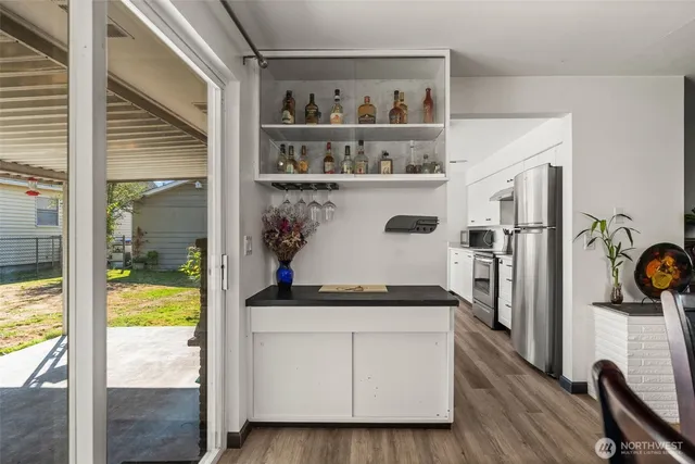 a patio with table and chairs