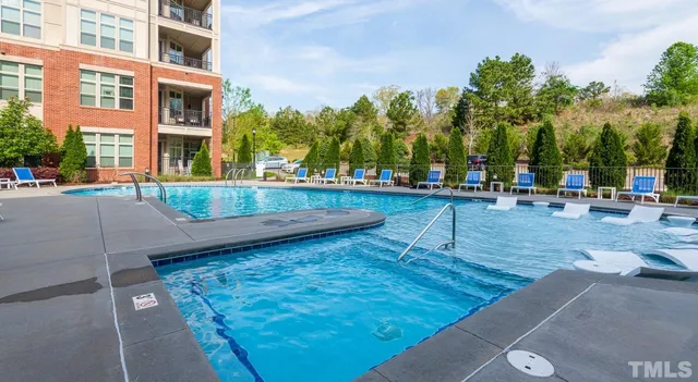 a swimming pool with outdoor seating yard and outdoor seating
