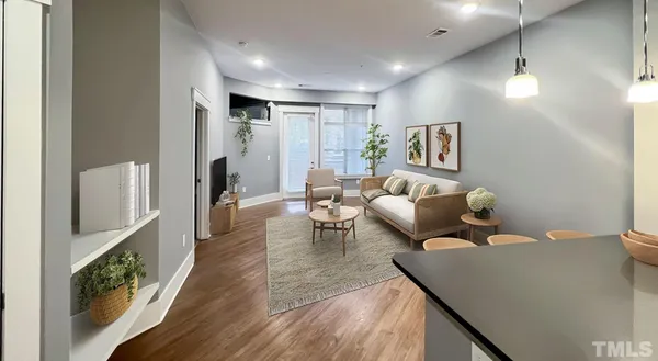 a bedroom with a bed and glass door