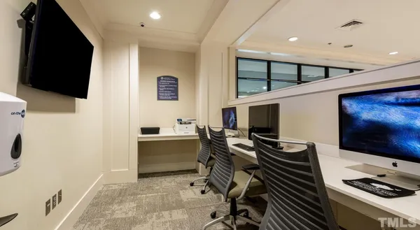 a room with furniture and flat screen tv