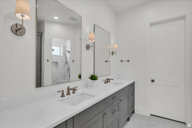 2608 Canyon Ridge Drive St. George, UT 84770 - Photo 28 of 86 Dual vanity with gray cabinetry, white countertops, and brushed nickel fixtures