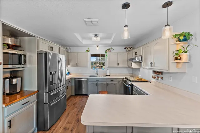 a kitchen with a sink and cabinets