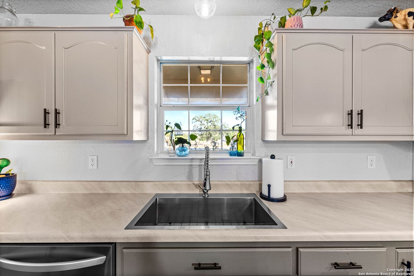 1265 Hillside Oaks Drive La Vernia, TX 78121 - Photo 15 of 72 a kitchen with a sink and cabinets