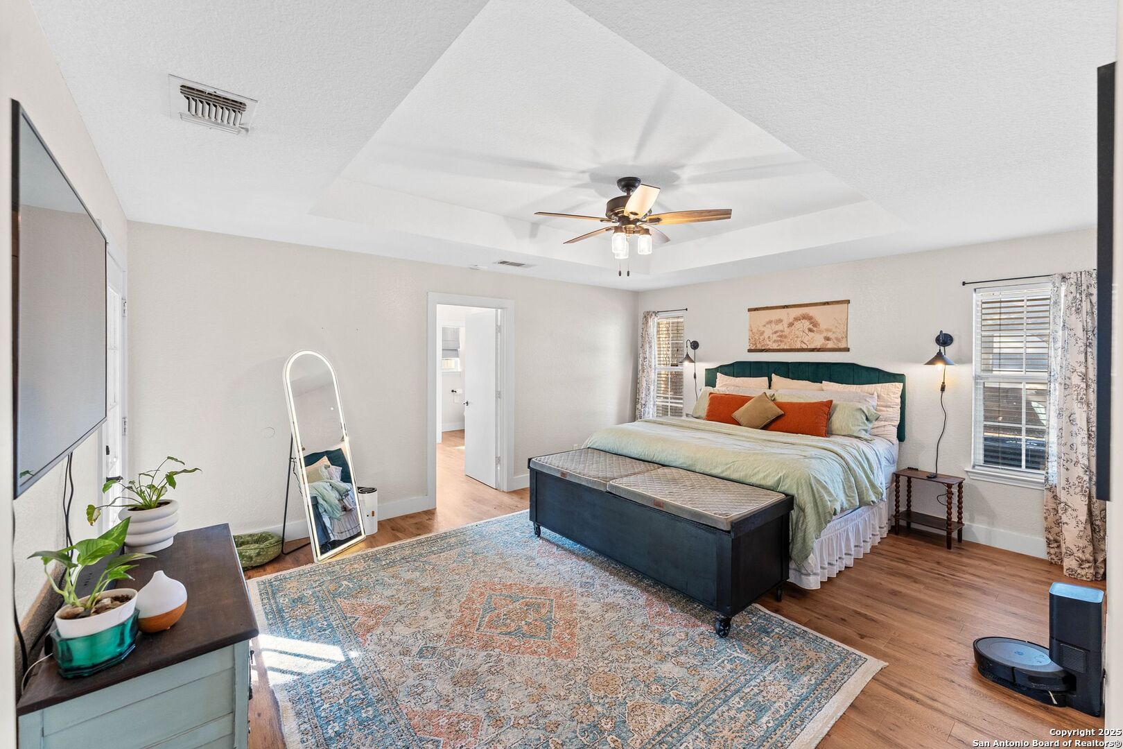 1265 Hillside Oaks Drive La Vernia, TX 78121 - Photo 17 of 72 a bedroom with a bed and wooden floor