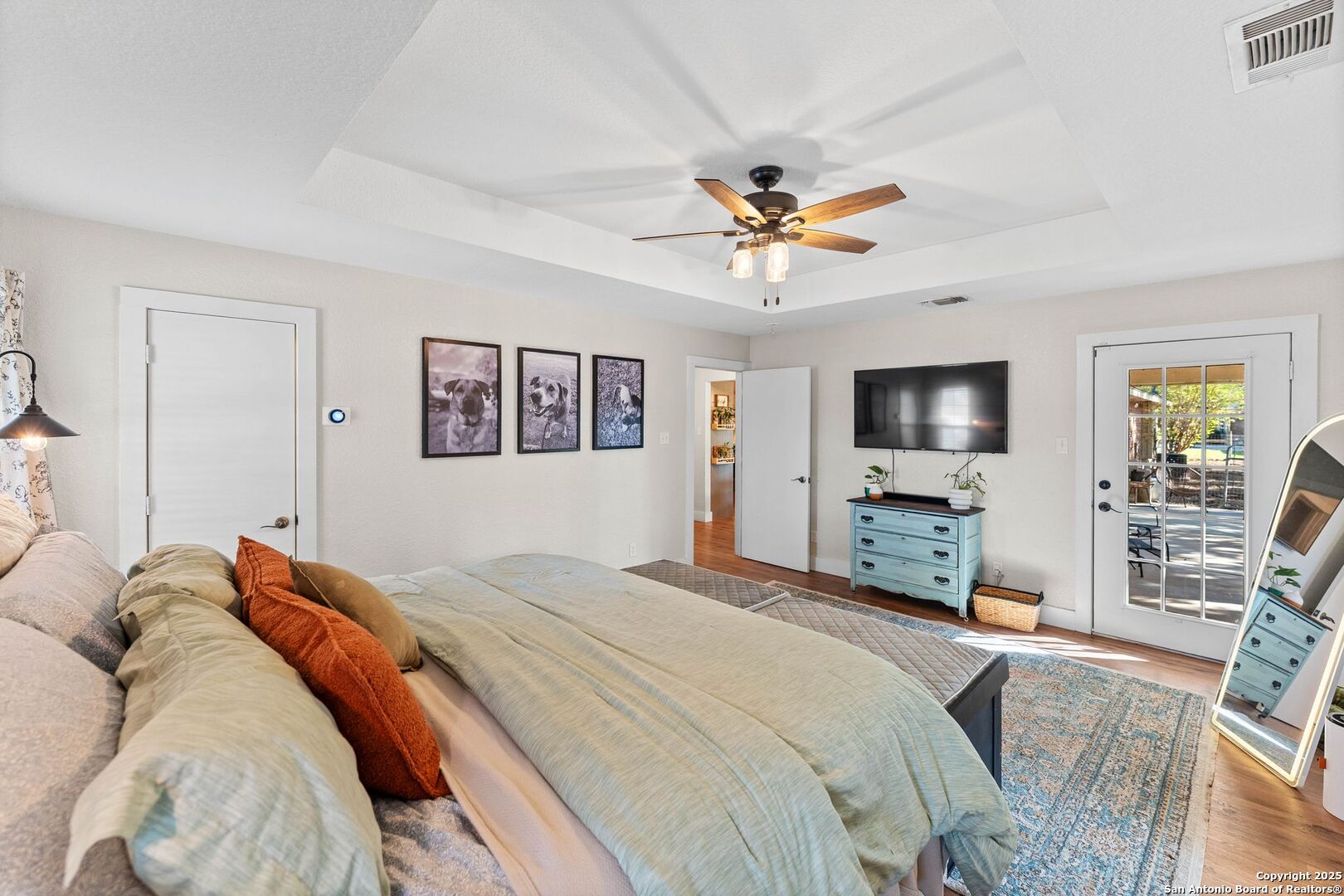 1265 Hillside Oaks Drive La Vernia, TX 78121 - Photo 18 of 72 a bedroom with a bed and a flat screen tv