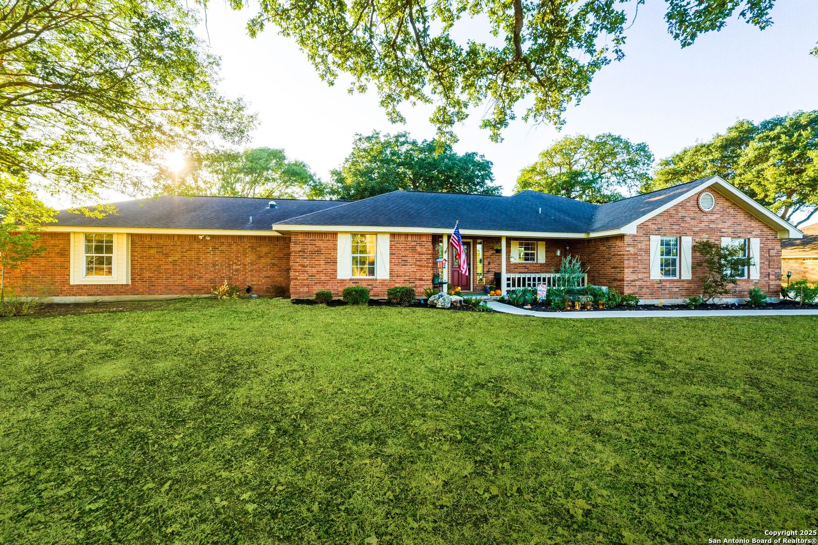 1265 Hillside Oaks Drive La Vernia, TX 78121 - Photo 2 of 72 a front view of a house with a yard and green space
