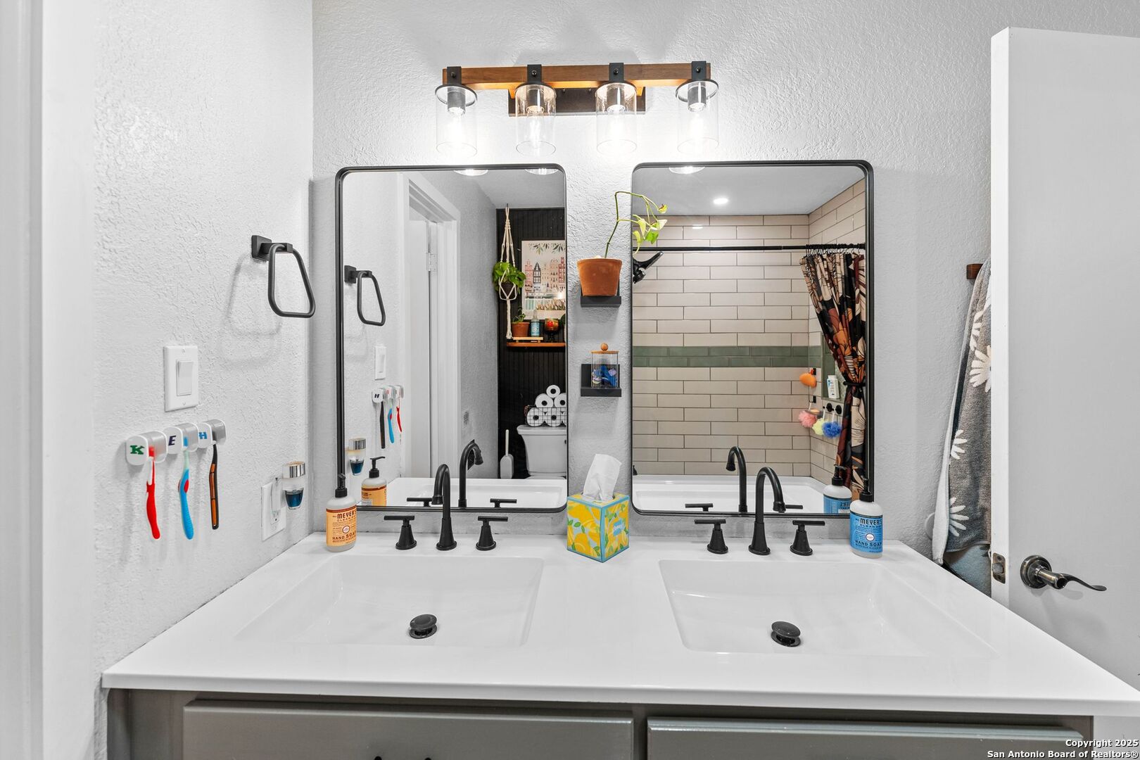 1265 Hillside Oaks Drive La Vernia, TX 78121 - Photo 23 of 72 a bathroom with a sink and a mirror