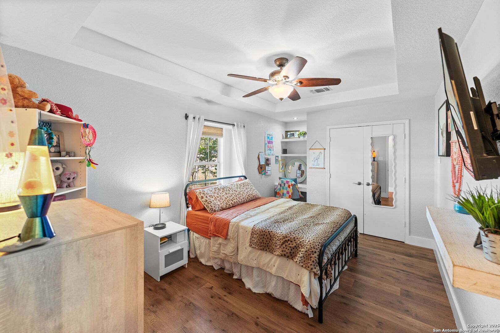 1265 Hillside Oaks Drive La Vernia, TX 78121 - Photo 24 of 72 a bedroom with a bed and wooden floor