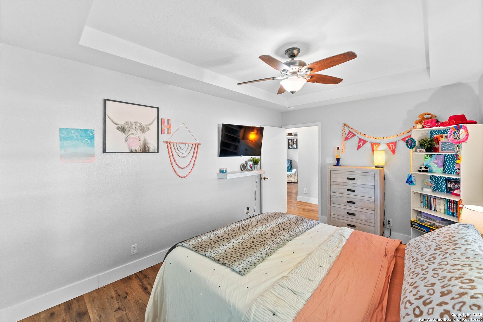 1265 Hillside Oaks Drive La Vernia, TX 78121 - Photo 25 of 72 a bedroom with a bed and a flat tv screen on the dresser