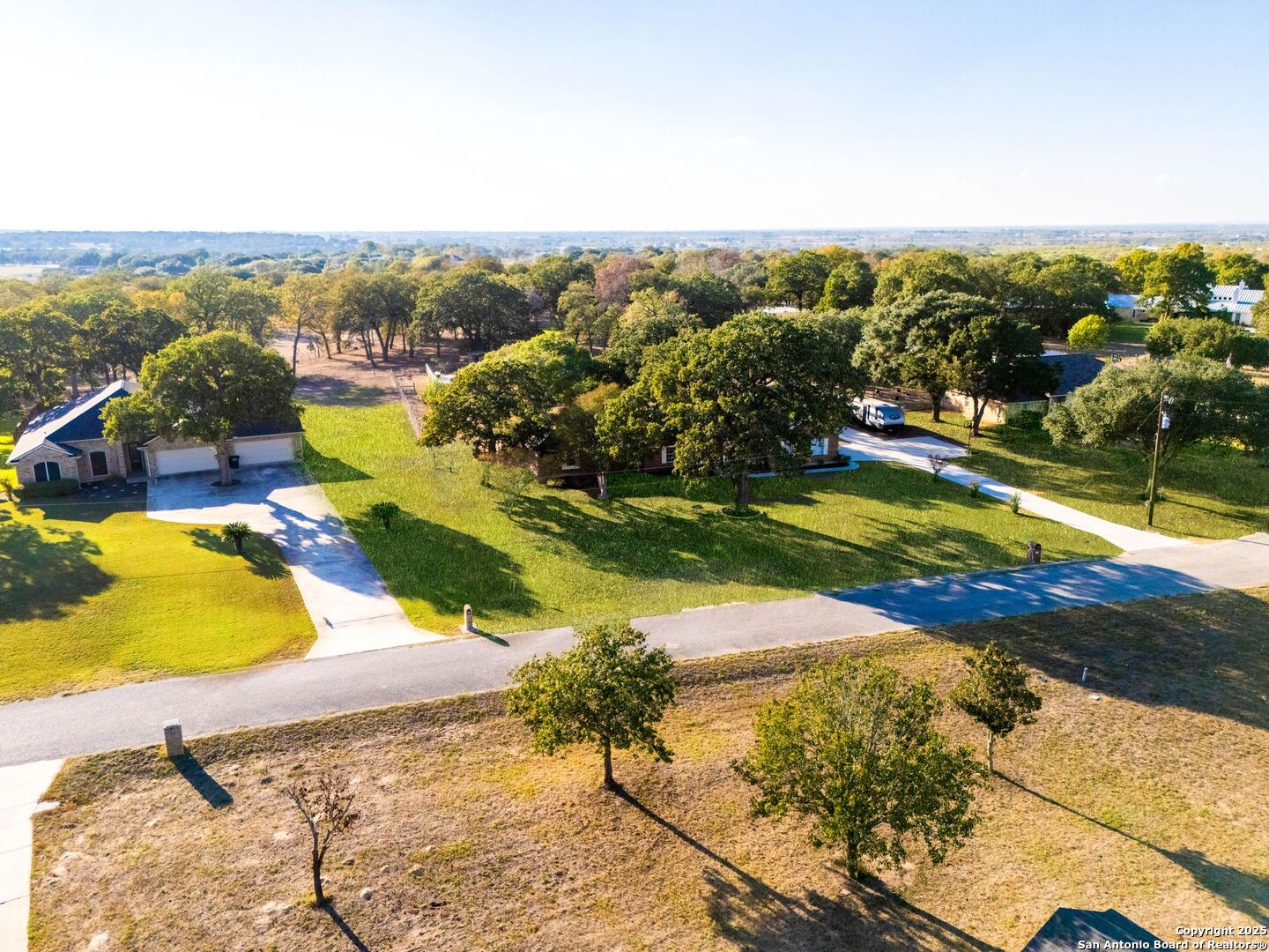 1265 Hillside Oaks Drive La Vernia, TX 78121 - Photo 42 of 72 a view of a swimming pool with a yard