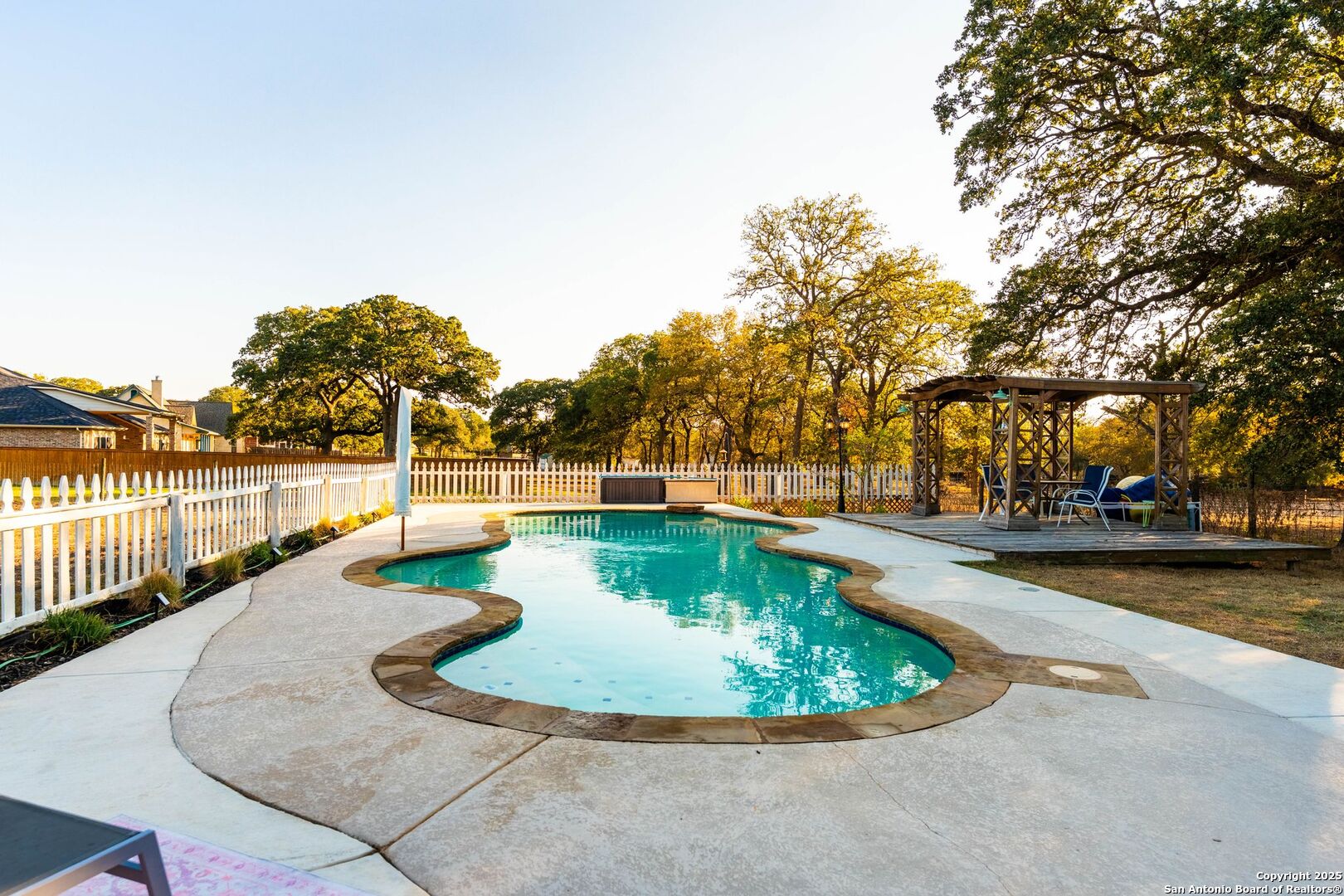 1265 Hillside Oaks Drive La Vernia, TX 78121 - Photo 43 of 72 a view of a swimming pool with an outdoor seating