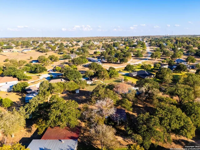 a view of a swimming pool with a yard