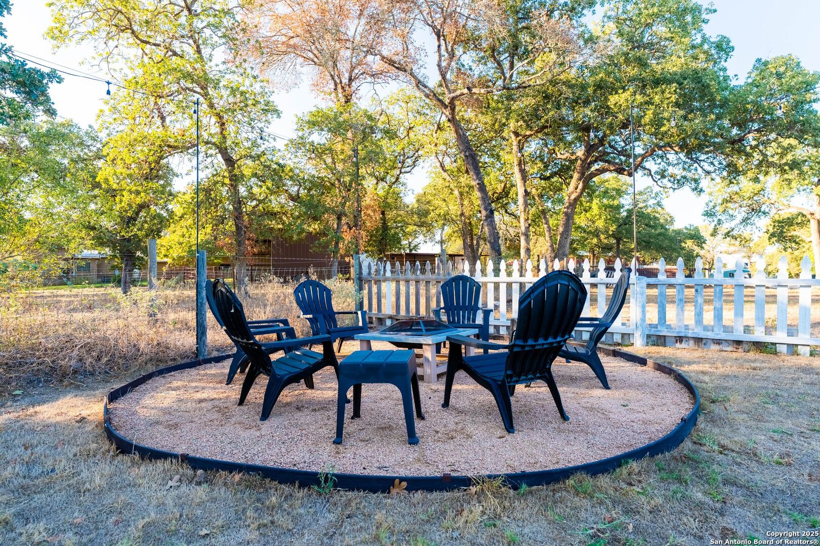 1265 Hillside Oaks Drive La Vernia, TX 78121 - Photo 50 of 72 a view of a dinning table and chairs in patio