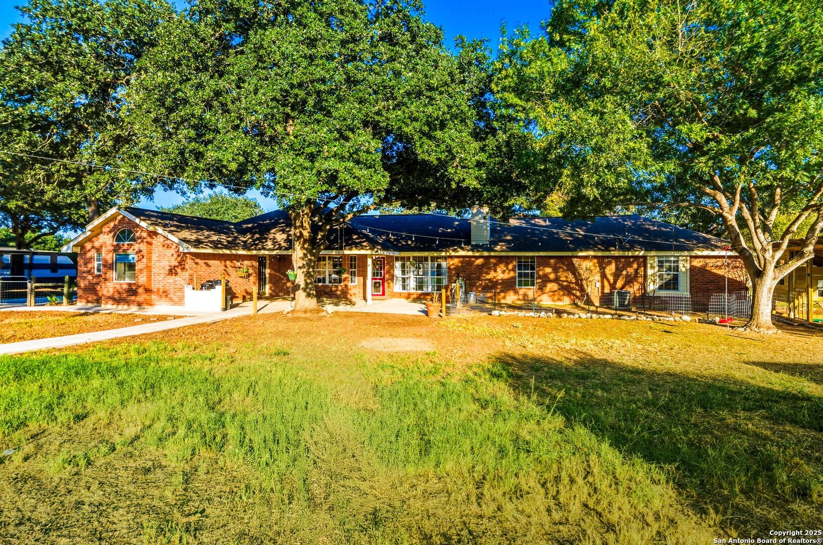 1265 Hillside Oaks Drive La Vernia, TX 78121 - Photo 5 of 72 a view of an swimming pool with an outdoor space and seating area