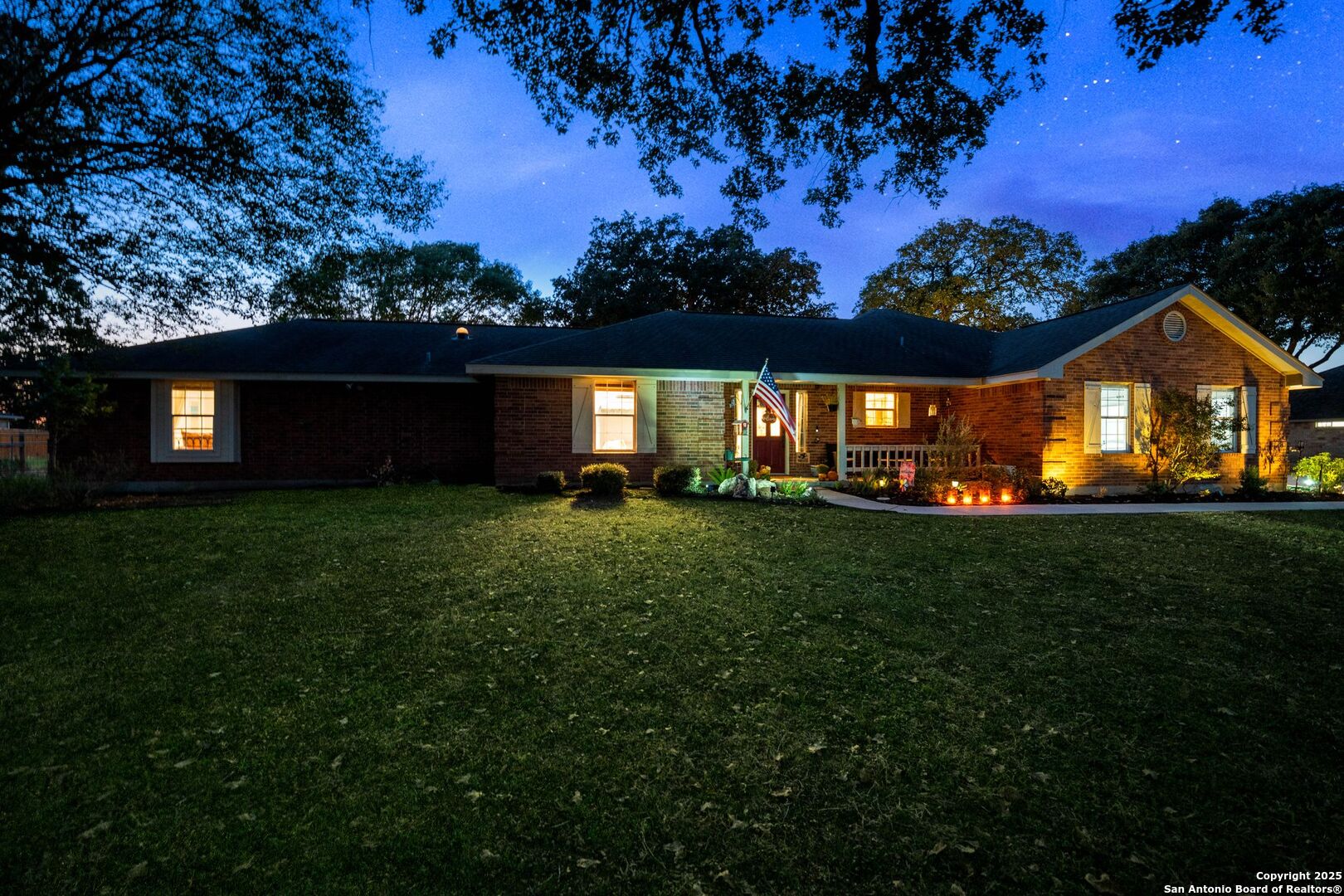 1265 Hillside Oaks Drive La Vernia, TX 78121 - Photo 61 of 72 a front view of a house with a garden