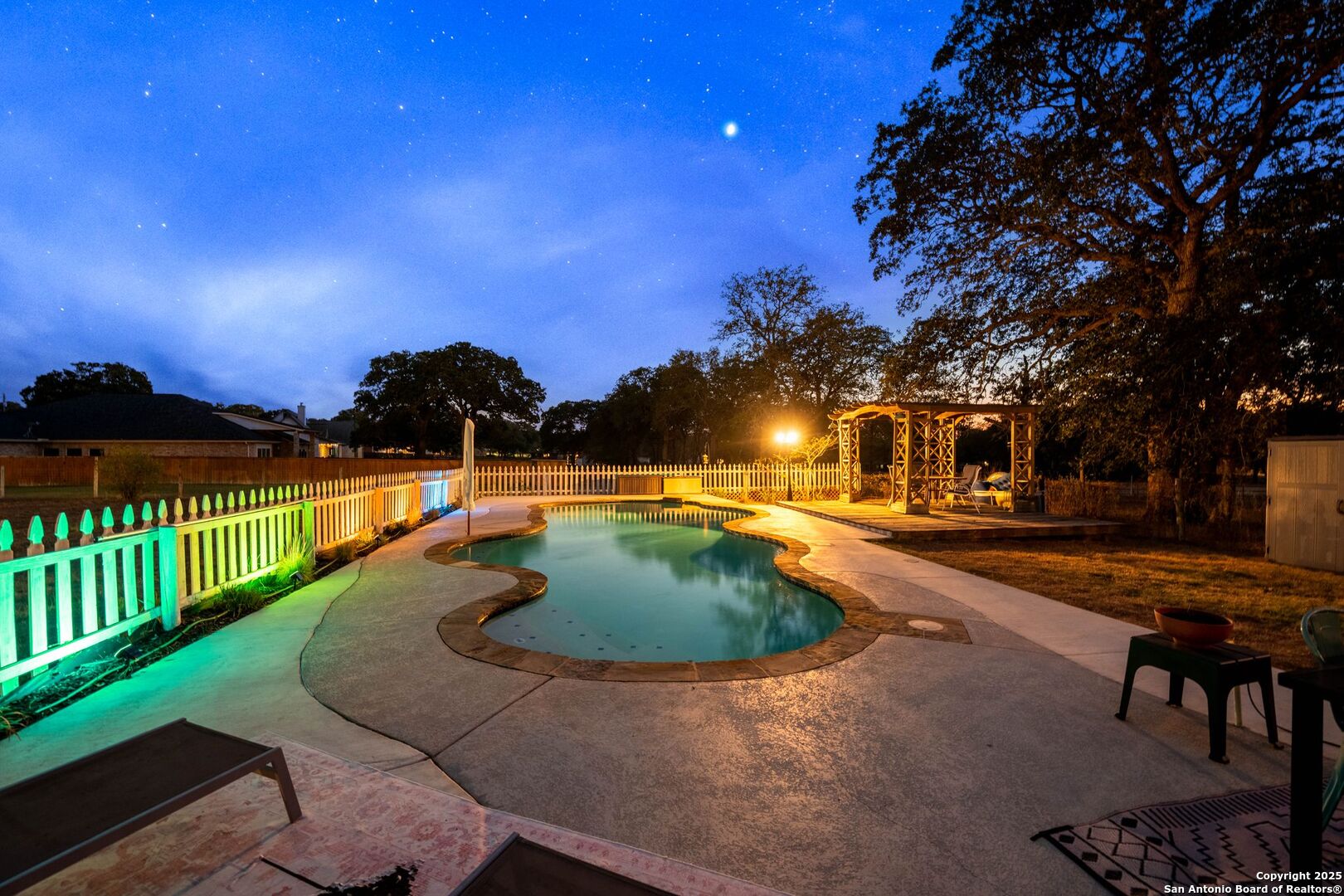 1265 Hillside Oaks Drive La Vernia, TX 78121 - Photo 65 of 72 a swimming pool with outdoor seating and yard