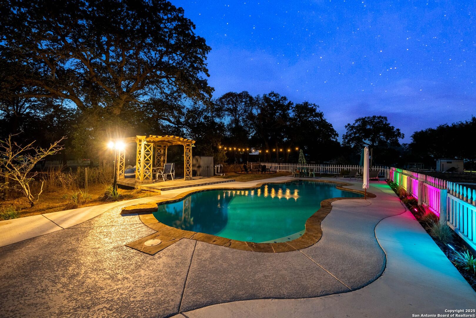 1265 Hillside Oaks Drive La Vernia, TX 78121 - Photo 66 of 72 a view of a swimming pool with a yard