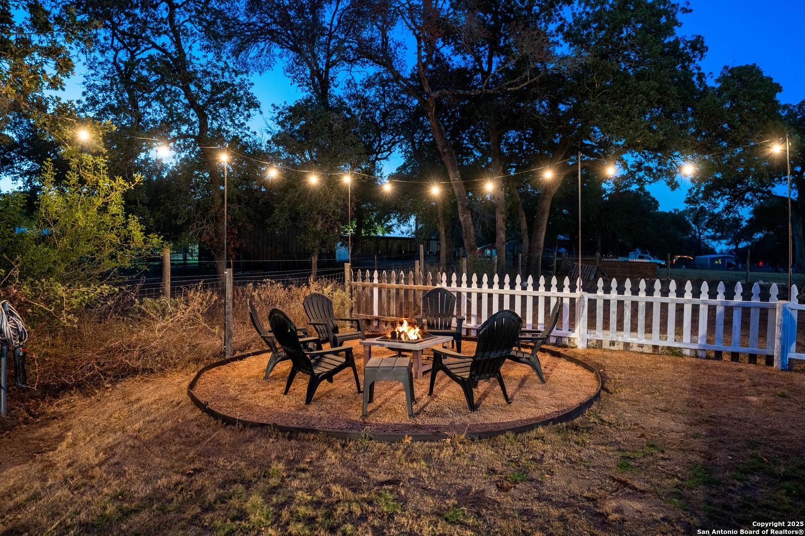 1265 Hillside Oaks Drive La Vernia, TX 78121 - Photo 68 of 72 a view of a wooden fence with a slide