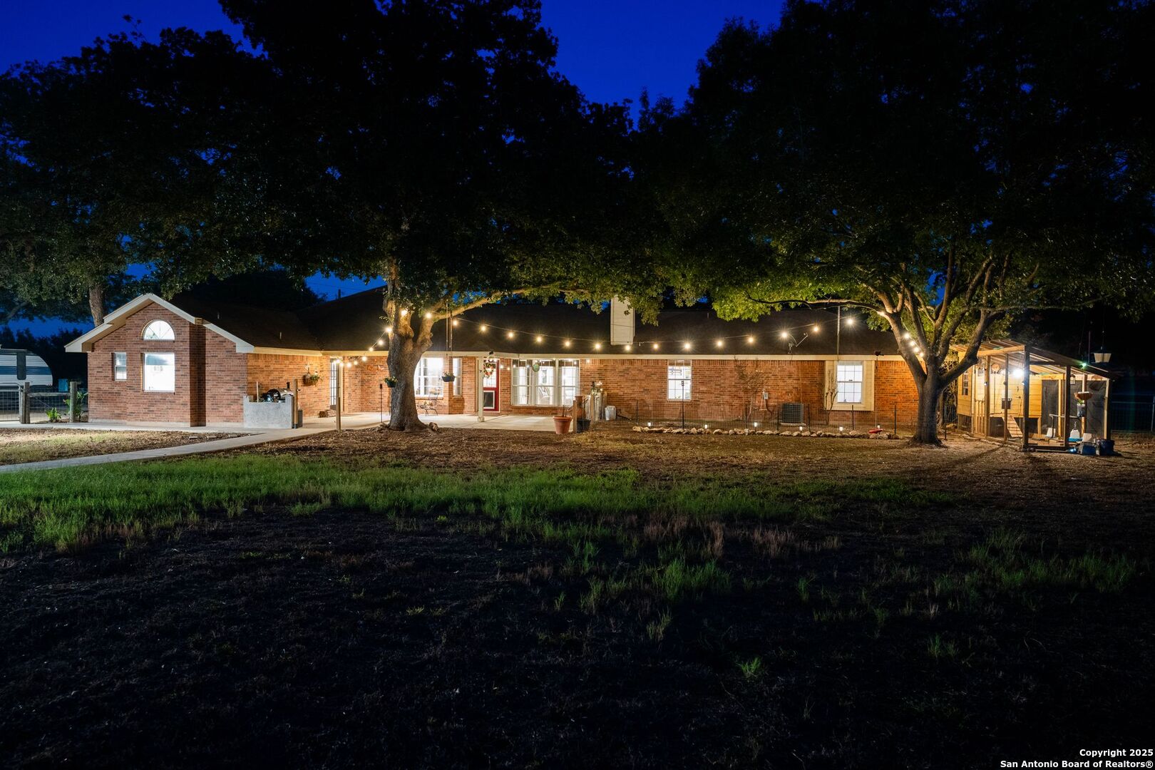 1265 Hillside Oaks Drive La Vernia, TX 78121 - Photo 69 of 72 a view of house with garden and tall trees