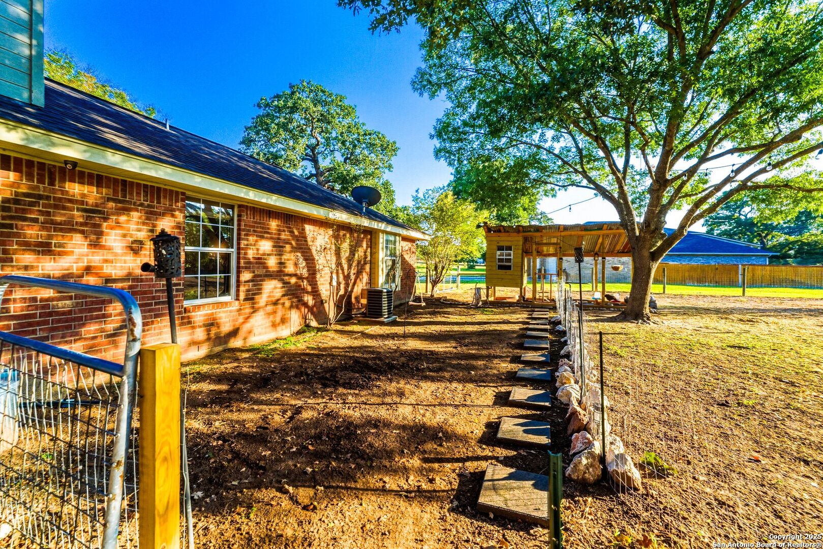 1265 Hillside Oaks Drive La Vernia, TX 78121 - Photo 71 of 72 a view of a yard with wooden fence