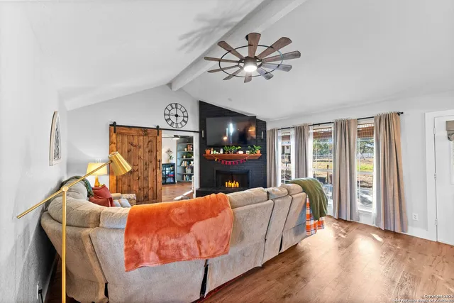 a living room with furniture and a rug