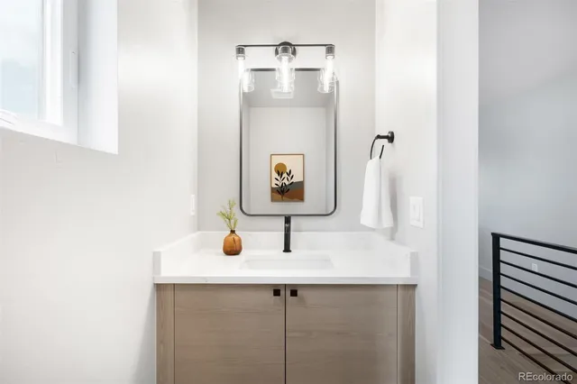 a bathroom with a sink and mirror