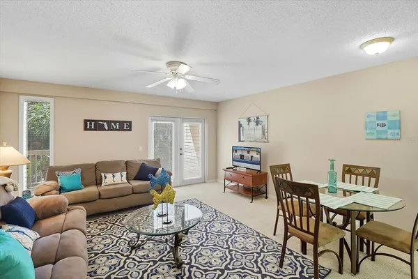 a living room with furniture and a table