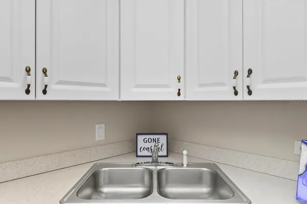 a bathroom with a sink and cabinets