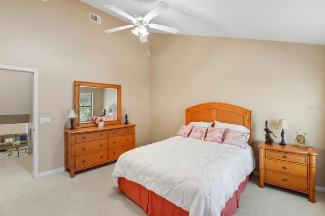 a bedroom with a bed and a dresser