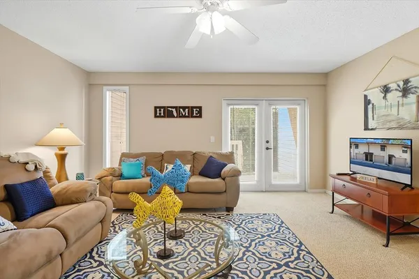 a living room with furniture and a rug