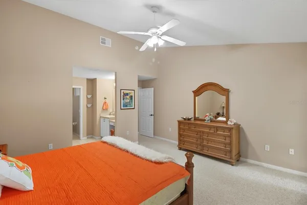 a bedroom with a bed and a dresser