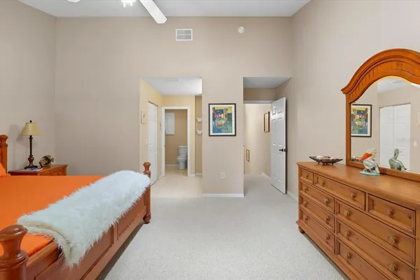 a bedroom with a bed and a dresser