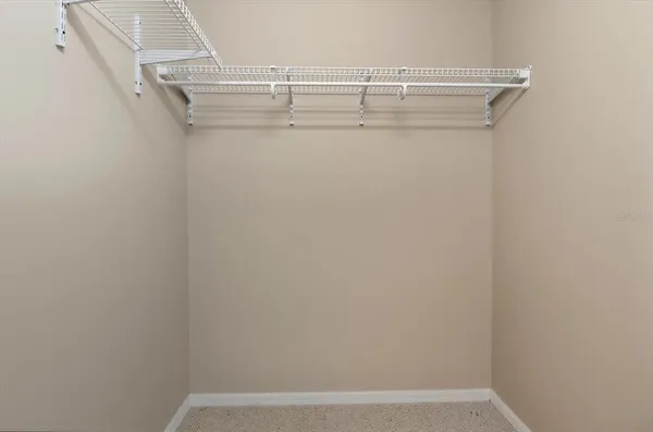 a view of a room with racks on the wall
