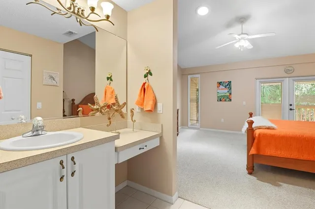 a en suite bathroom with a double vanity sink and mirror