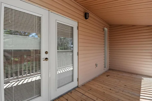 a view of a door and a window
