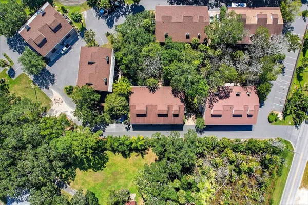 an aerial view of a house with a garden