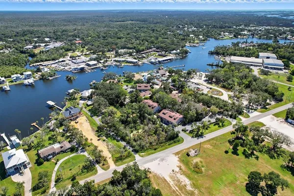 an aerial view of residential houses with outdoor space