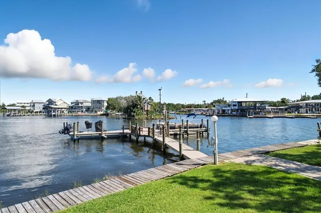 a view of a lake with outdoor seating