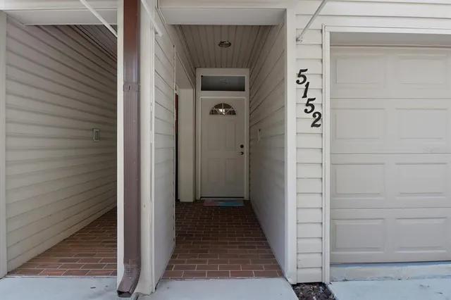 a view of hallway with wooden floor