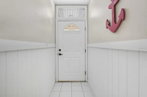 a view of an entryway with wooden floor