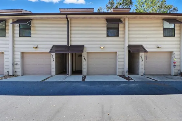 a front view of a house with a garage