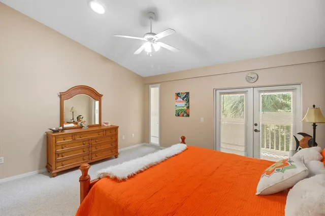 a bedroom with a bed dresser and a window